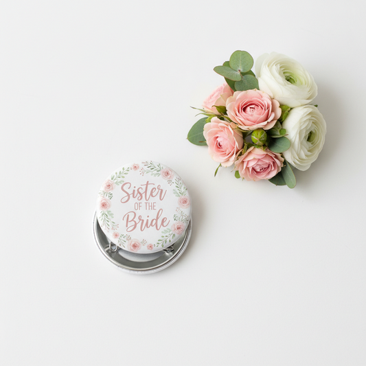 Round wedding pinback button with pink floral border and text "Sister of the Bride"