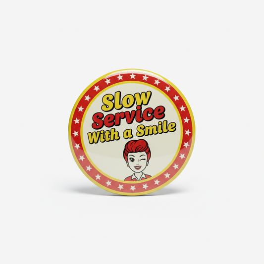 Round pinback button: red star border, “Slow Service With a Smile” text, smiling server