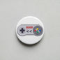 Super Nintendo controller pinback button, round white with controller graphic and colored buttons