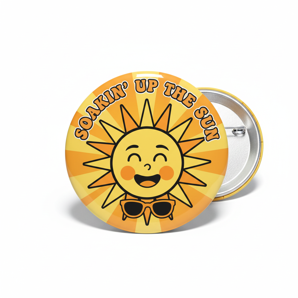 A round pin-back button badge featuring a smiling cartoon sun with rays and the text 'SOONIN' UP THE SUN' in orange and brown, shown on a white background with the back of another badge partially visible behind it.