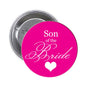 Round pink pinback button with "Son of the Bride" text and heart design