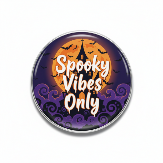 Round Halloween pinback button with purple haunted house scene and “Spooky Vibes Only” text