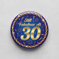 Purple round pinback button with gold "Still Fabulous At 30" design