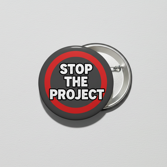 2.25-inch political pinback button with 'STOP THE PROJECT' text in black/red.
