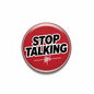 Red round pinback button with bold STOP TALKING text and white soundwave graphic