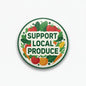 2.25-inch round pinback badge with 'SUPPORT LOCAL PRODUCE' and produce icons