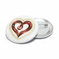 Heart-shaped pinback button with red-and-gold swirl design, silver backing