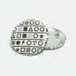 Round black-and-white symbol pinback button with silver metal clasp