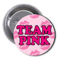 Round pink pinback button: 'TEAM PINK' text on camo pattern, 1.25-inch