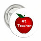 Teacher button pinback with red apple '#1 Teacher' graphic, silver metal backing