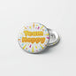 Round Team Happy pinback button with colorful text and crown, metal backing.