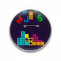 Tetris pinback button, round purple design with colorful pixel blocks and silver pin clasp