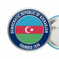 Circular Azerbaijan pinback with blue rim, flag colors, crescent, and Founded 1918 text