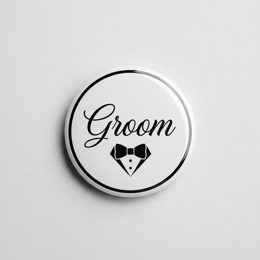 Groom pinback button with white face, black border, “Groom” script and tuxedo icon