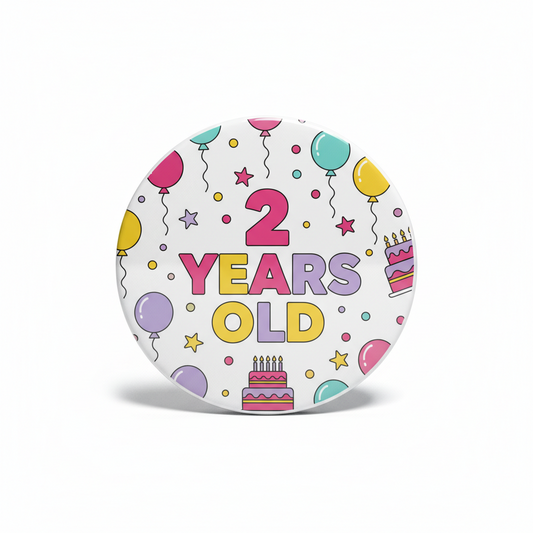 Round birthday pinback button with colorful balloons, cake, and “2 Years Old” text