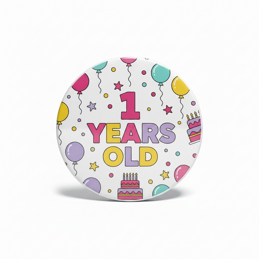 Round 1-year birthday pinback with multicolor balloons, party icons, and “1 YEARs OLD”.