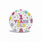 Round 1-year birthday pinback with multicolor balloons, party icons, and “1 YEARs OLD”.