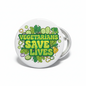 Round white pinback button with green text "VEGETARIANS SAVE LIVES" and plant icons