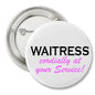 Round waitress pinback button with white face, black WAITRESS, pink cordially at your Service!