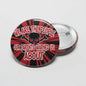 2.25-inch pinback button with red and black skull graphic and bold slogan text