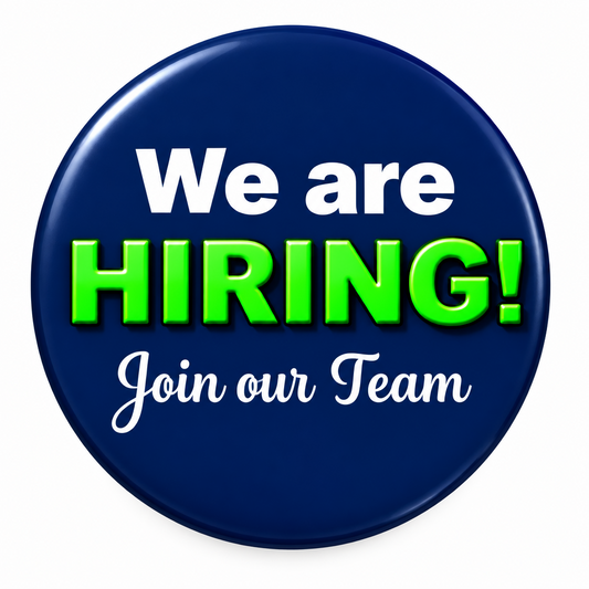 A circular navy blue graphic with the text 'We are HIRING! Join our Team' in white and bright green lettering on a plain white background.