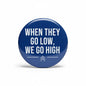 2.25-inch pinback button, dark blue with white slogan "WHEN THEY GO LOW, WE GO HIGH".
