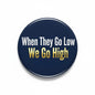 2.25-inch pinback button, navy with 'When They Go Low We Go High' text