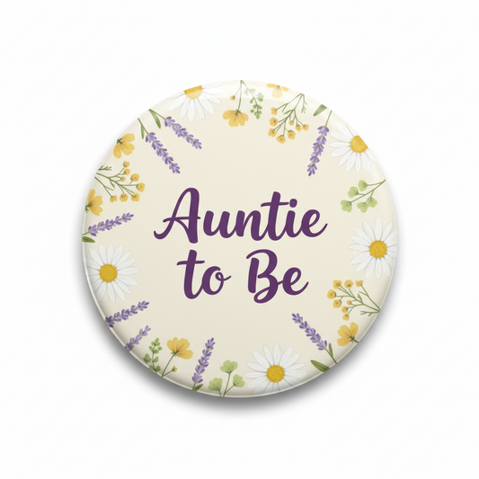 Floral pinback button: 'Auntie to Be' with purple, yellow, green flowers