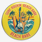 Round yellow surf guitar pinback button with bikini woman, waves, and Beach Babe text