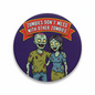2.25-inch round pinback button with purple zombie cartoon and bold slogan