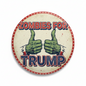 3-inch circular pinback featuring zombie thumbs up and the text Zombies for Trump